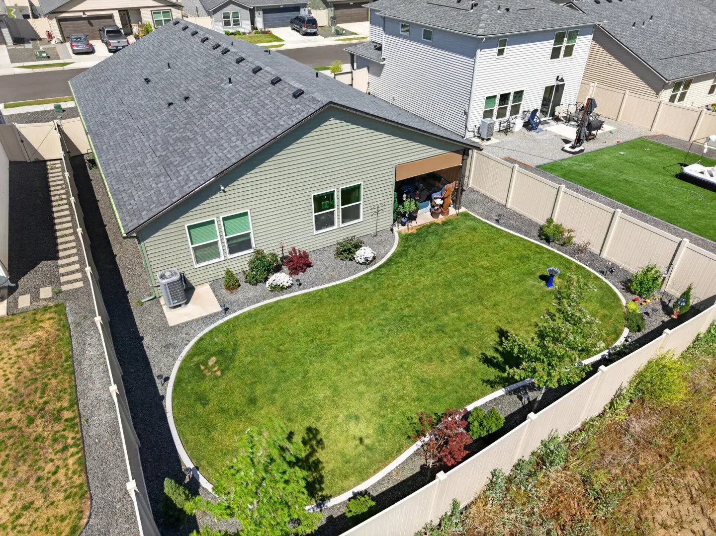Aerial overhead view of backyard with birdbath and landscaping