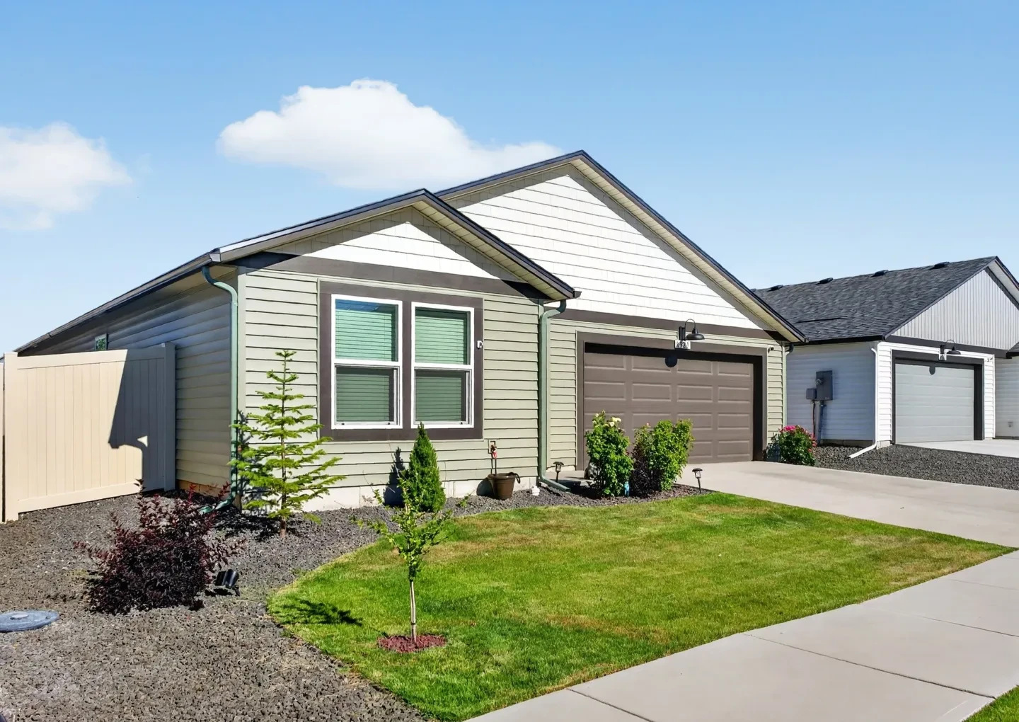 Backyard with manicured lawn and birdbath