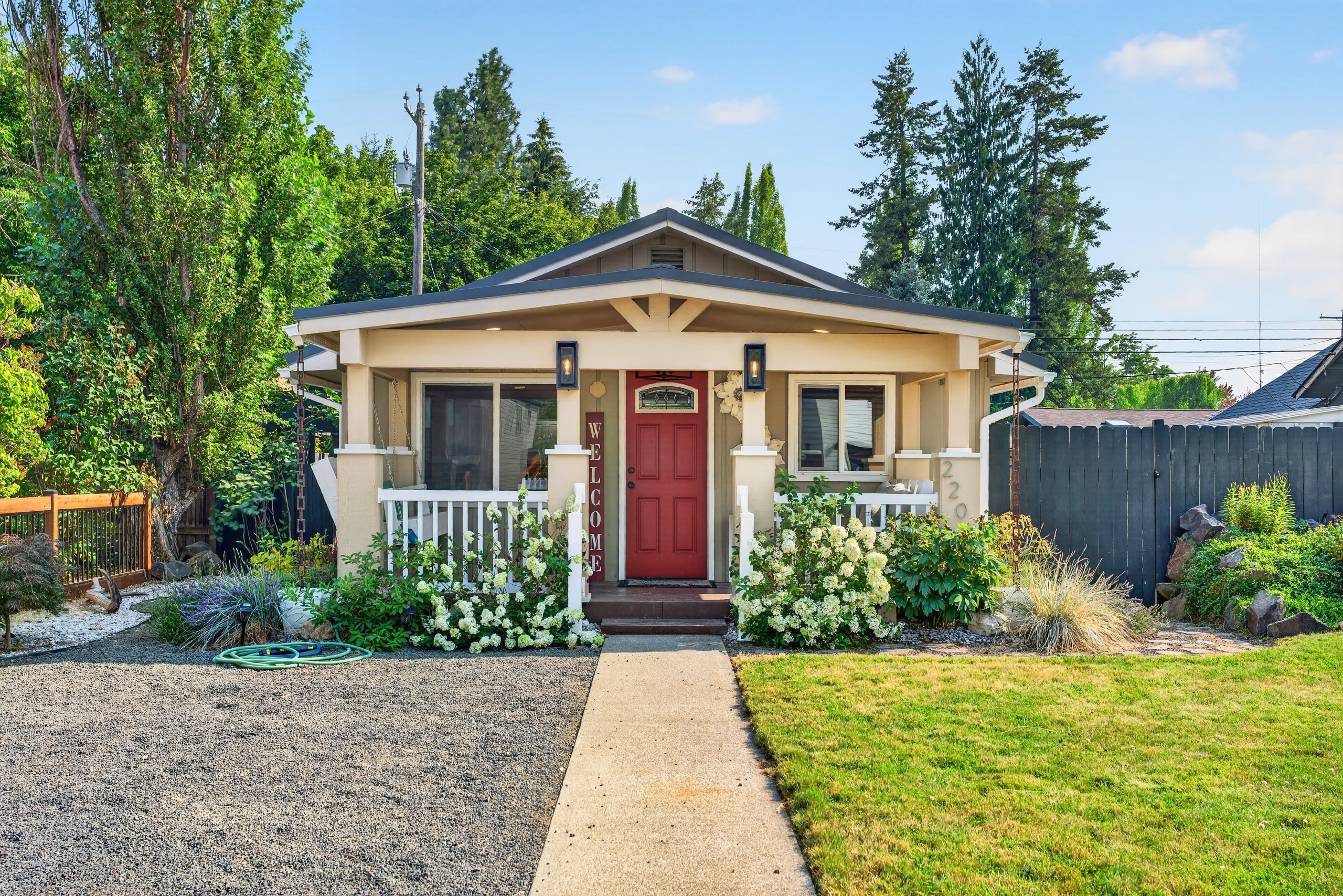 Wide backyard with landscaping and fence