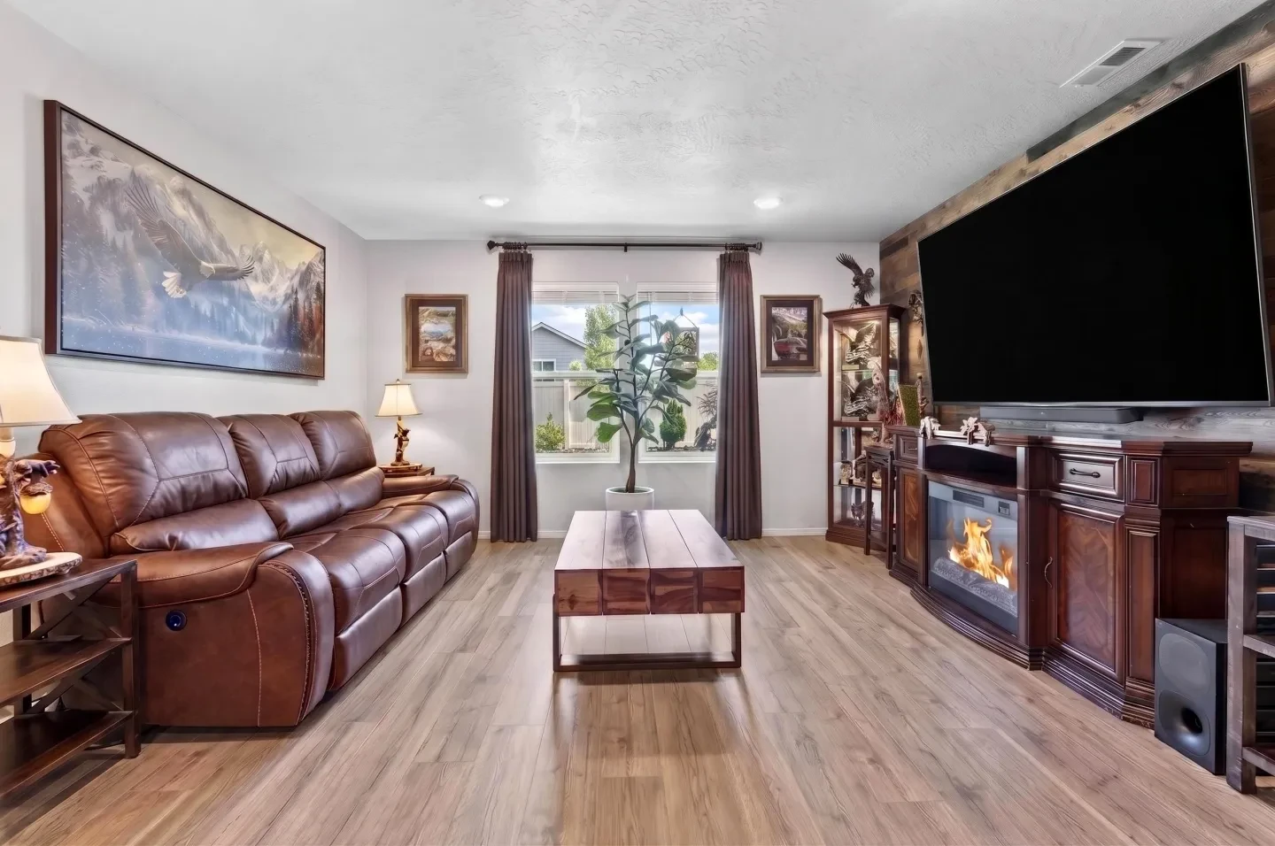 Living room with leather sofa and fireplace